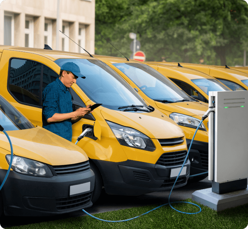 Benefits of fleet tracking shown by a row of electric vans and a man