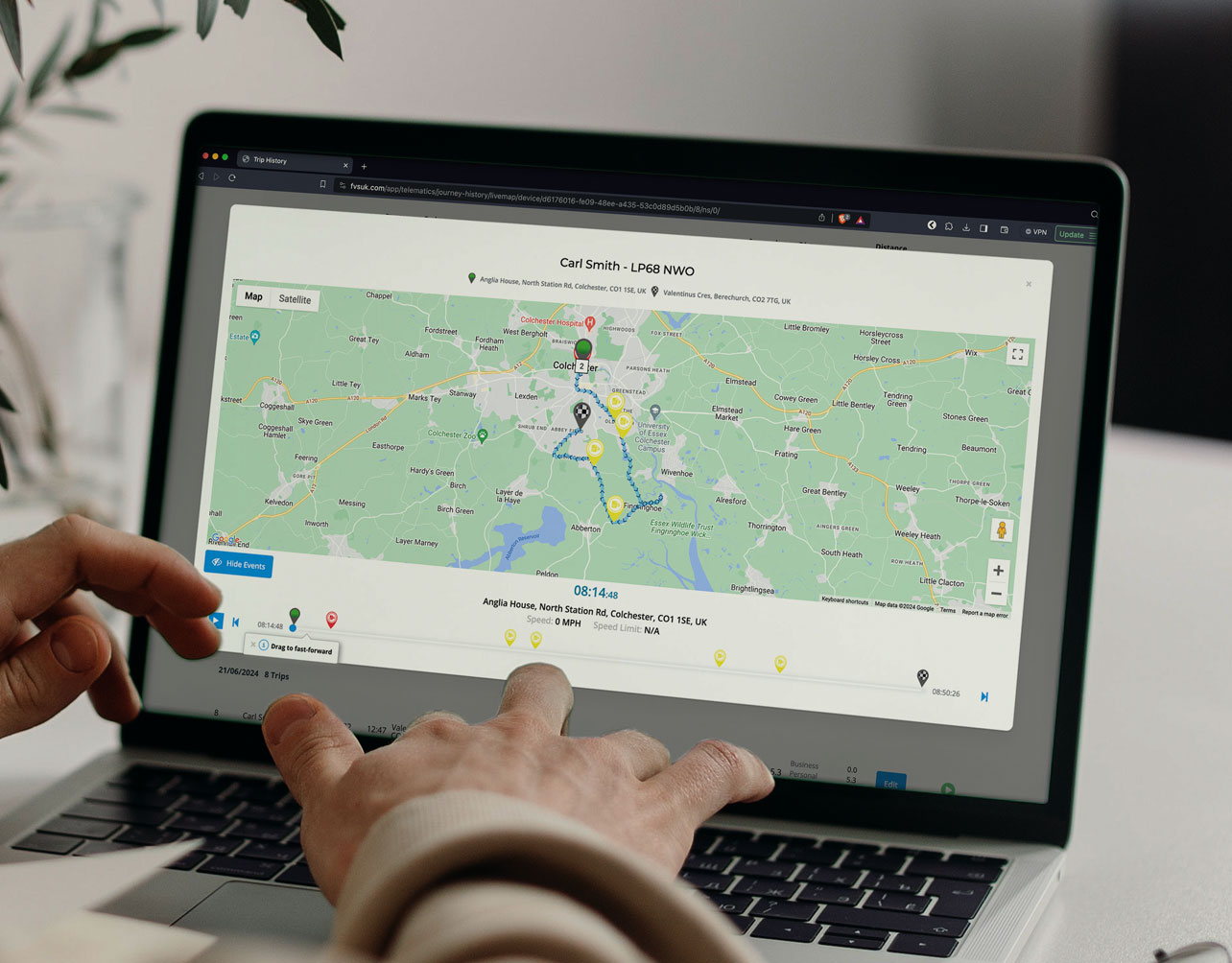 GPS Fleet Tracking shown by someone on a laptop trackin a vehicle in real time.